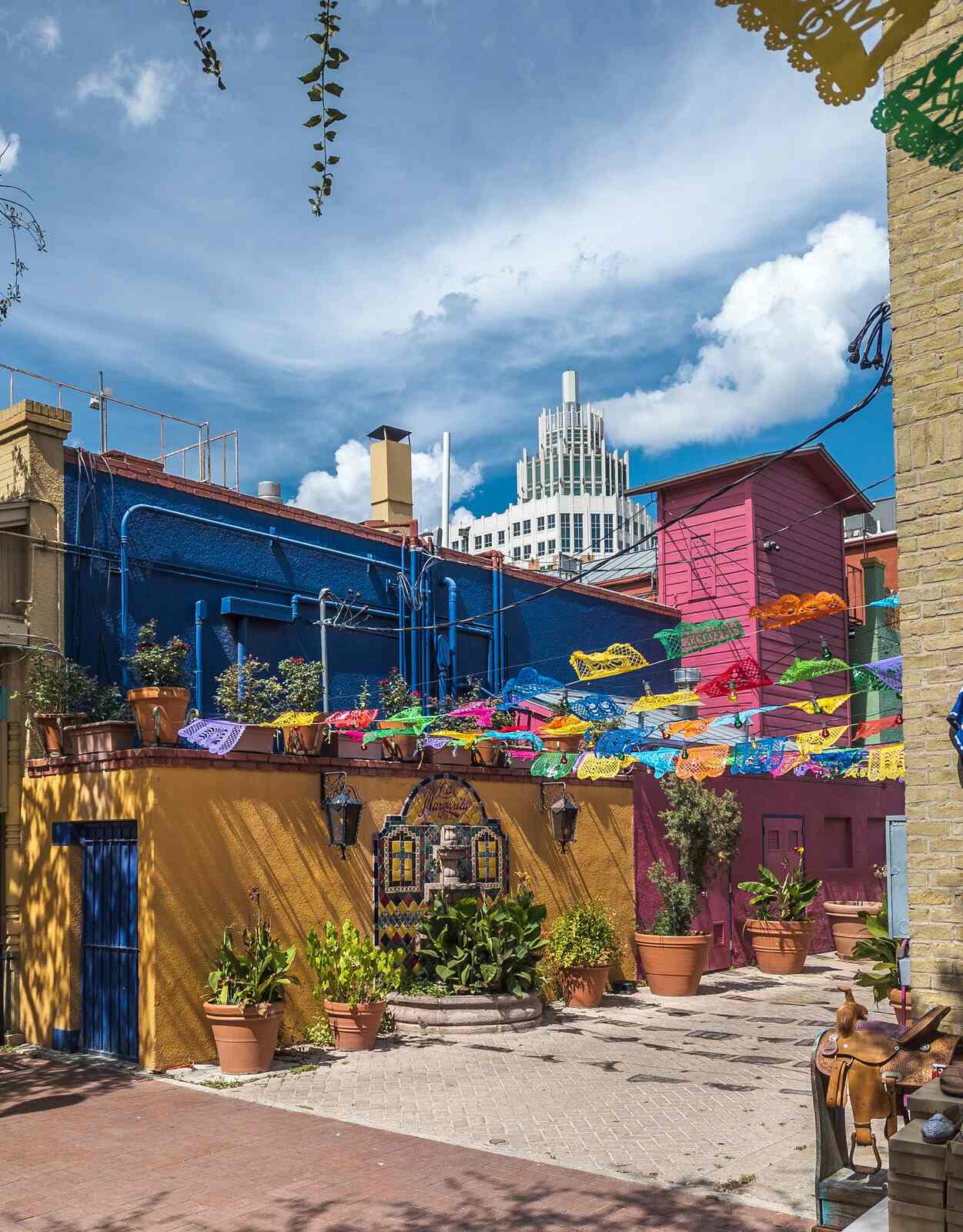 Colourful courtyard with papel picado banners in a San Antonio market district