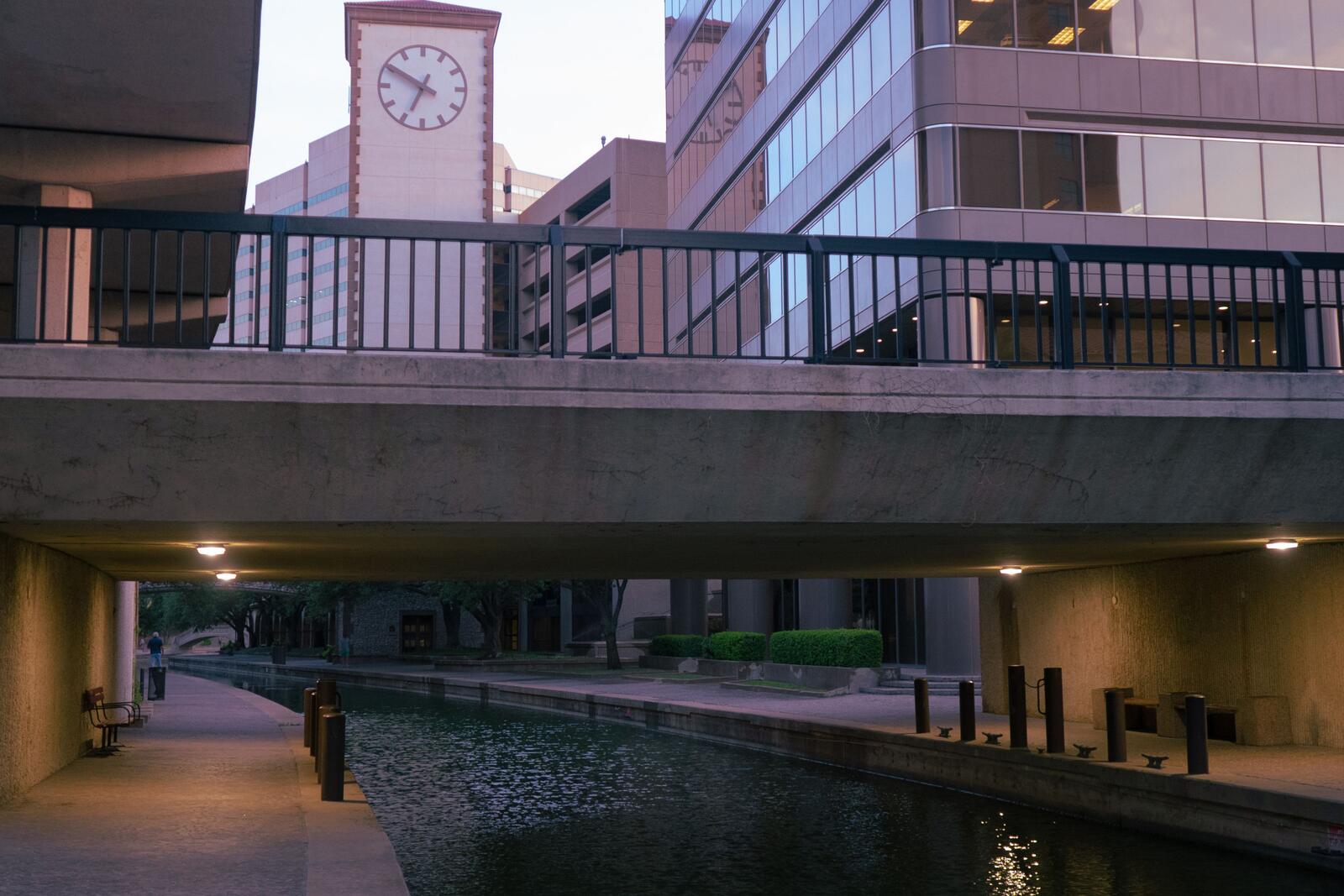 River channel passing beneath a terraced downtown San Antonio building